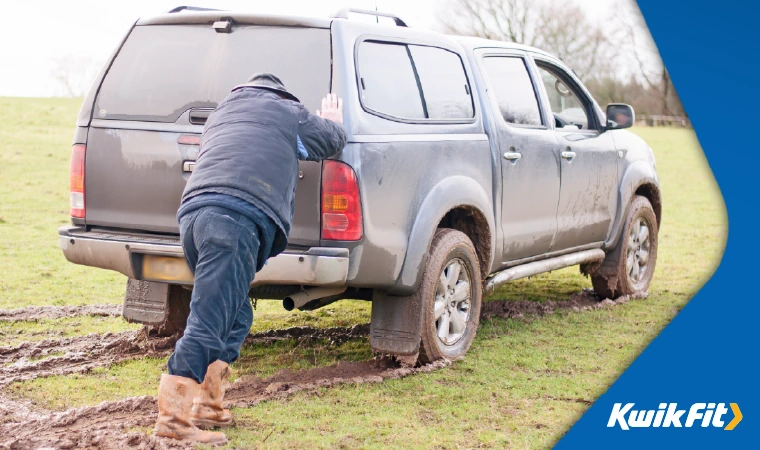pushing your car out of a muddy field